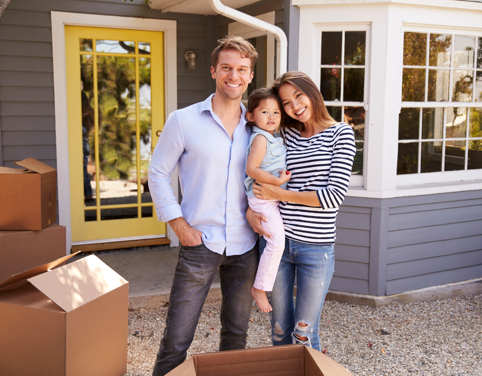 family unpacking at new home